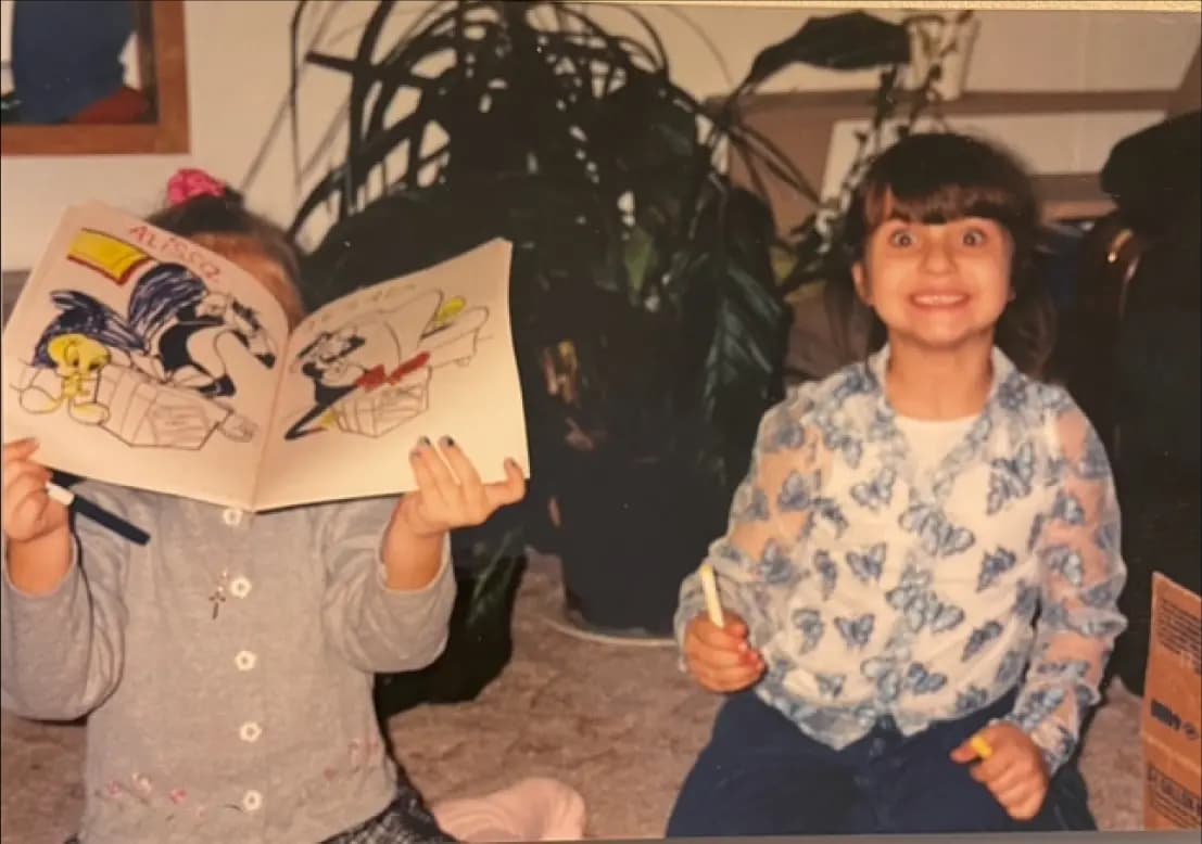 Alissa holding a paint up when she was a child